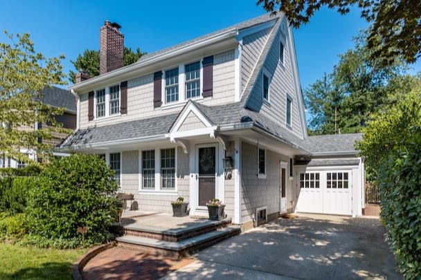 James Hardie coastal-grey Colonial exterior with a shingle gable